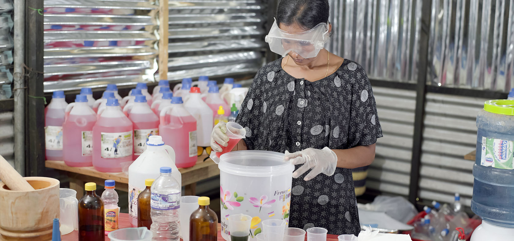 Uma Maheswary mixes ingredients in her cleaning products facility adjoining her house in Eluthoor, Mannar in Northern Province of Sri Lanka on 2 November 2022.  Photo: UN Women Sri Lanka/Raveendra Rohana