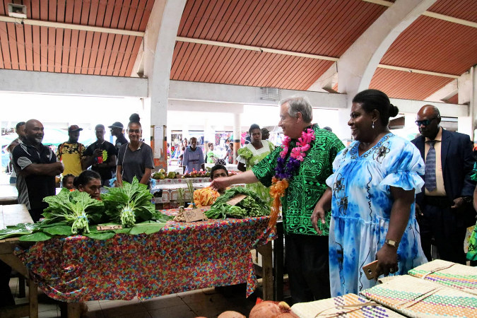 Women market vendors in Vanuatu greet UN Secretary General Antonio Guterres at Port Vila market during his visit to the Pacific in 2019. 
