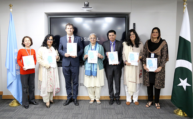 Representatives from UNDP and UN Women holding Gender Equality in Public Administration (GEPA) Report. Photo: UNDP/Shuja Hakim