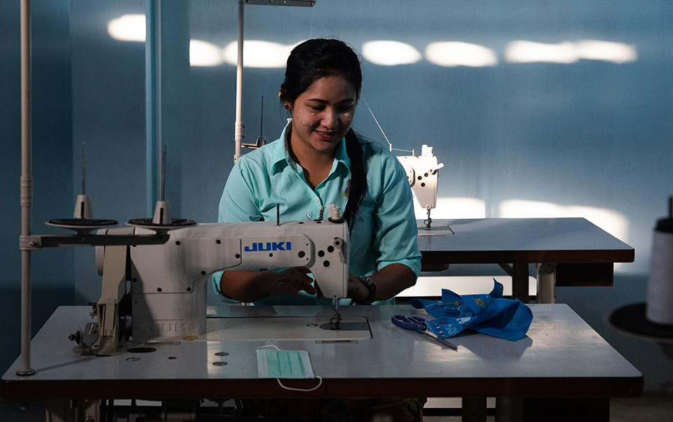 A Muslim migrant woman from Myanmar, pictured at the Islamic Community Center in Mae Sot, Thailand, where she studies sewing skills and learns about the difference between safe and unsafe migration. Photo: UN Women/Stephanie Simcox