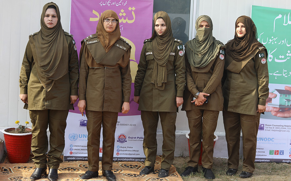 A separate police unit manned entirely by trained female police officers make women feel safer and secure to report violence and access services. Farzana Kausar (second from the left) poses with other officers in front of the Women and Juvenile Facilitation Centre in Gujrat, Pakistan. Photo was taken on 17 December 2019.   Photo: UNODC 