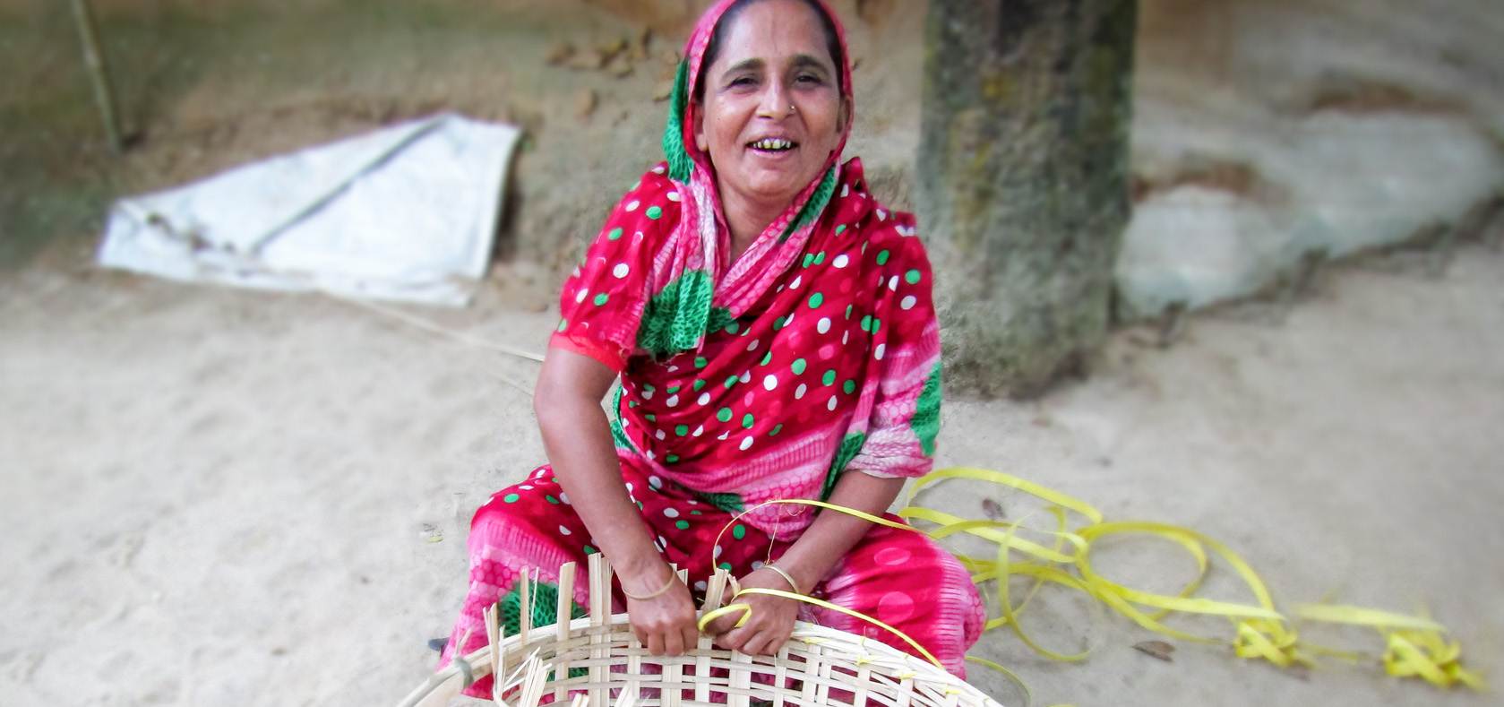 Shahana Begum on 02 September, 2021, from Noapur, Cumilla, is skillfully weaving a basket made from bamboo. She has chosen to fight for survivors of violence, much like herself. Photo: DRISTI/Shyamal Barua Boby.