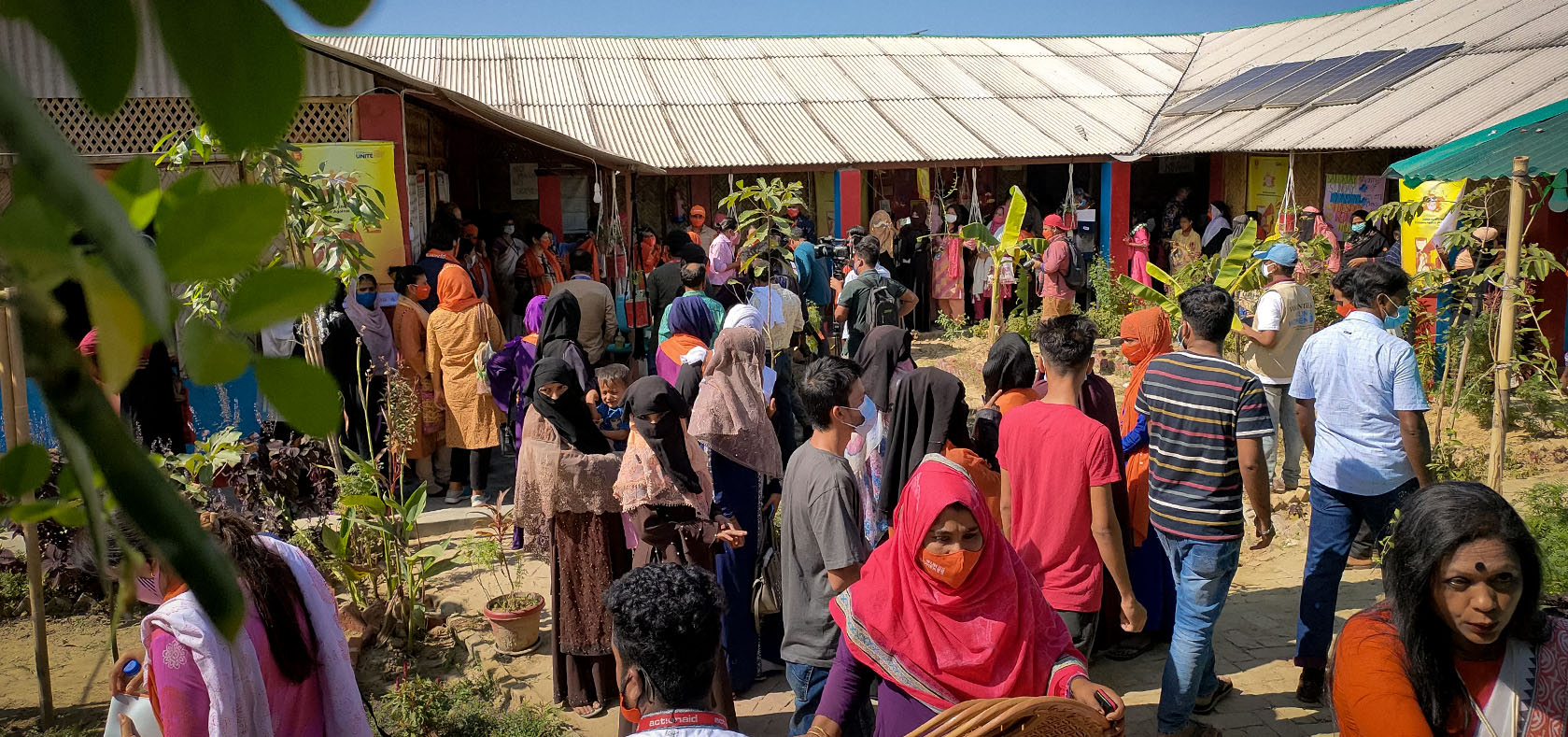 People gather for a fair at the UN Women Multi-purpose Women’s Centre in Rohingya Camp-4 Extension in Cox’s Bazar, Bangladesh, on 30 November 2021 to mark the United Nations 16 Days of Activism against Gender-based Violence. Photo: UN Women