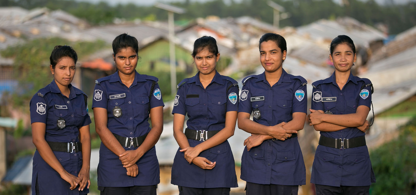 Bangladeshi police officers pose for a photo at their duty station inside a camp for Rohingya refugees in Cox’s Bazar, Bangladesh. Photo: UN Women/Allison Joyce