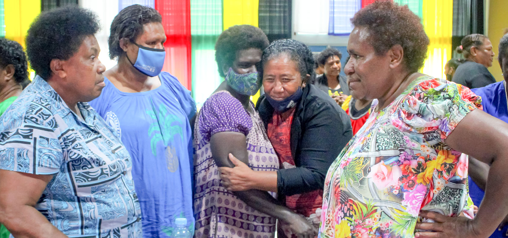 A group of PNG women are talking and greetings