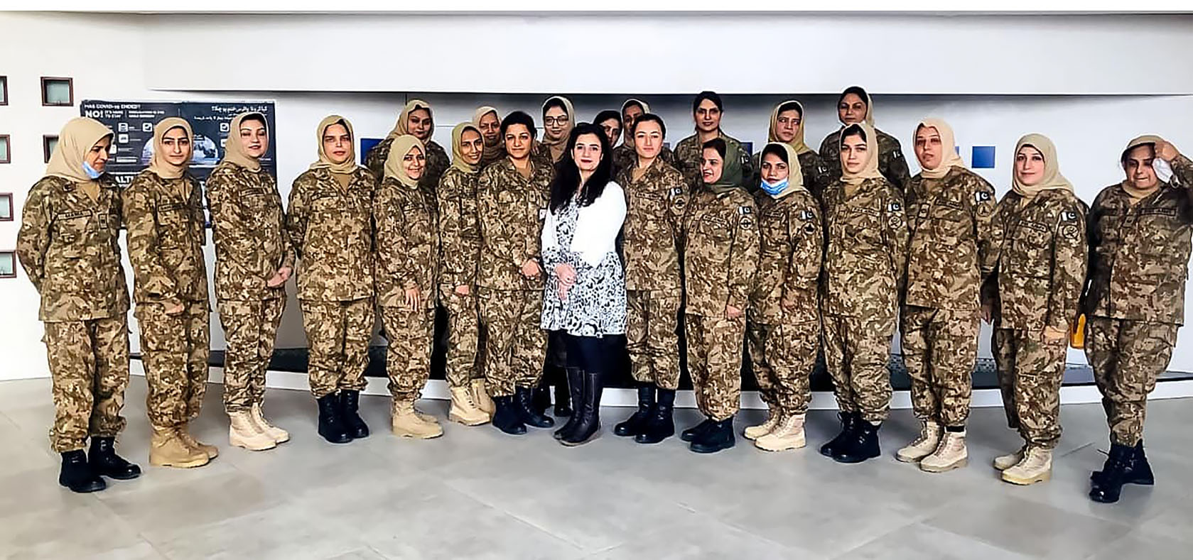 Dr. Farah Naz poses with Pakistani female peacekeepers at the National University of Sciences & Technology in Islamabad, Pakistan, on 15 December 2021. Photo: Courtesy of the University