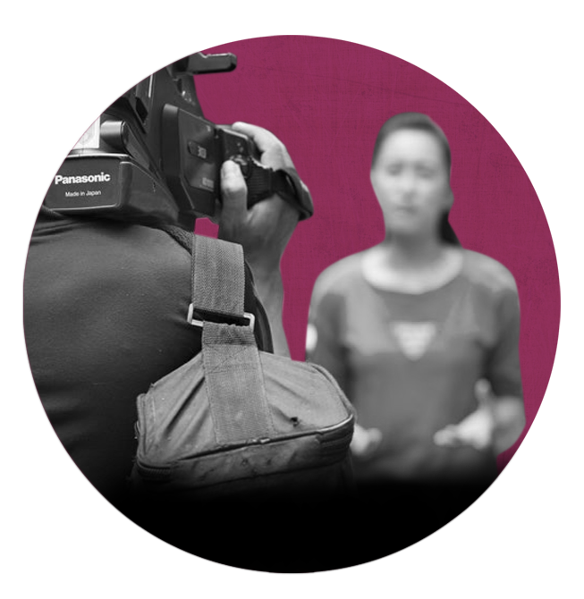 A female journalist from Vietnam talking to a camera.