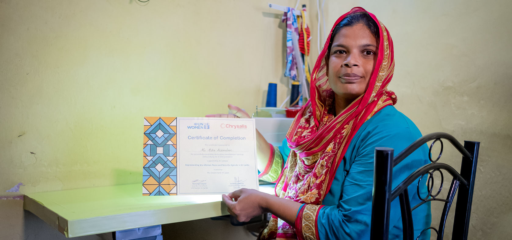 Aysha shows the certificate she received at the end of the training at her home in Colombo-2, Sri Lanka on 9 December 2022. Photo: UN Women Sri Lanka/Ruvin De Silva