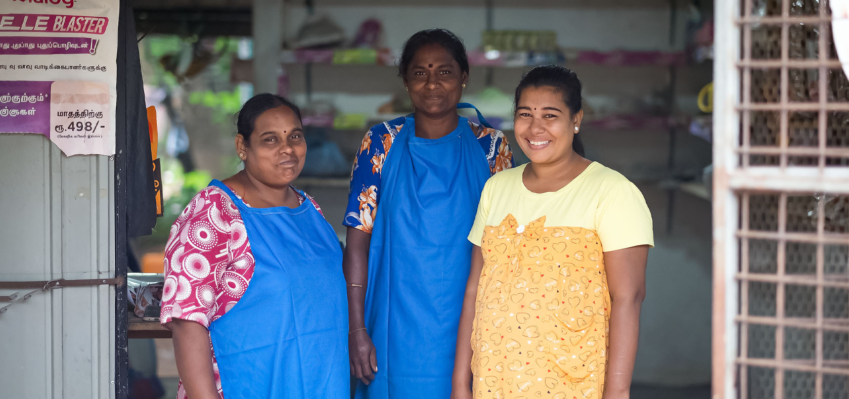 Jeyavinoja pictured with her co-workers at her grocery shop in Puliyankulam, Vavuniya, Sri Lanka on 8 December 2022. Photo: UN Women Sri Lanka/Ruvin De Silva