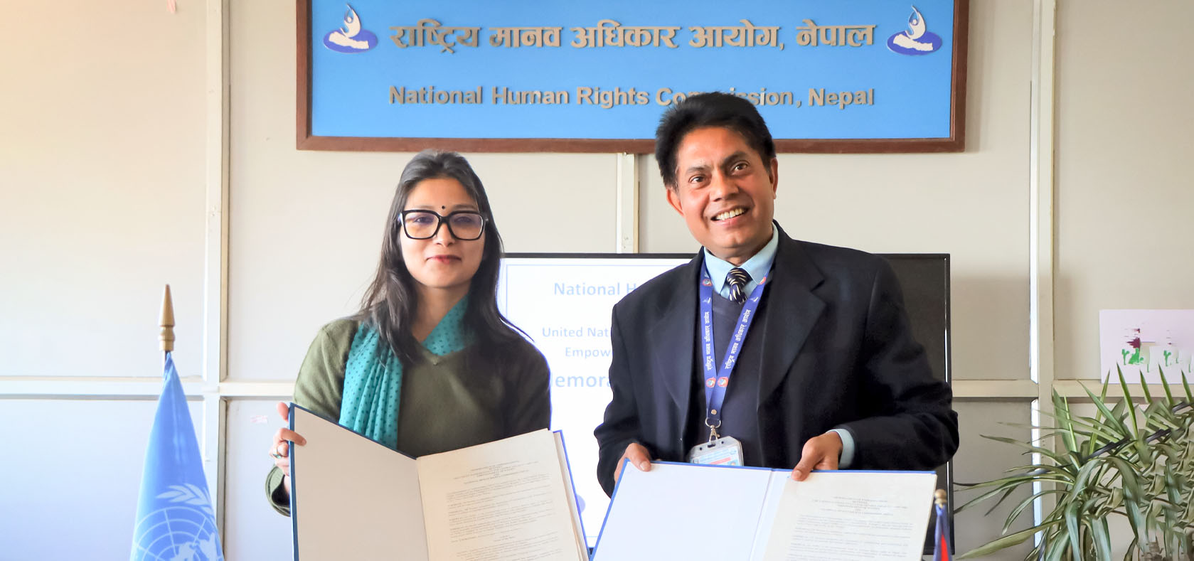Navanita Sinha, Head of Office a.i., (left) and Murari Prasad Khanal, Acting Secretary, National Human Rights Commission Nepal (right) sign the MoU on Strengthening Collaboration to Advance Gender Equality and Human Rights. Photo: UN Women/Subeksha Poudel