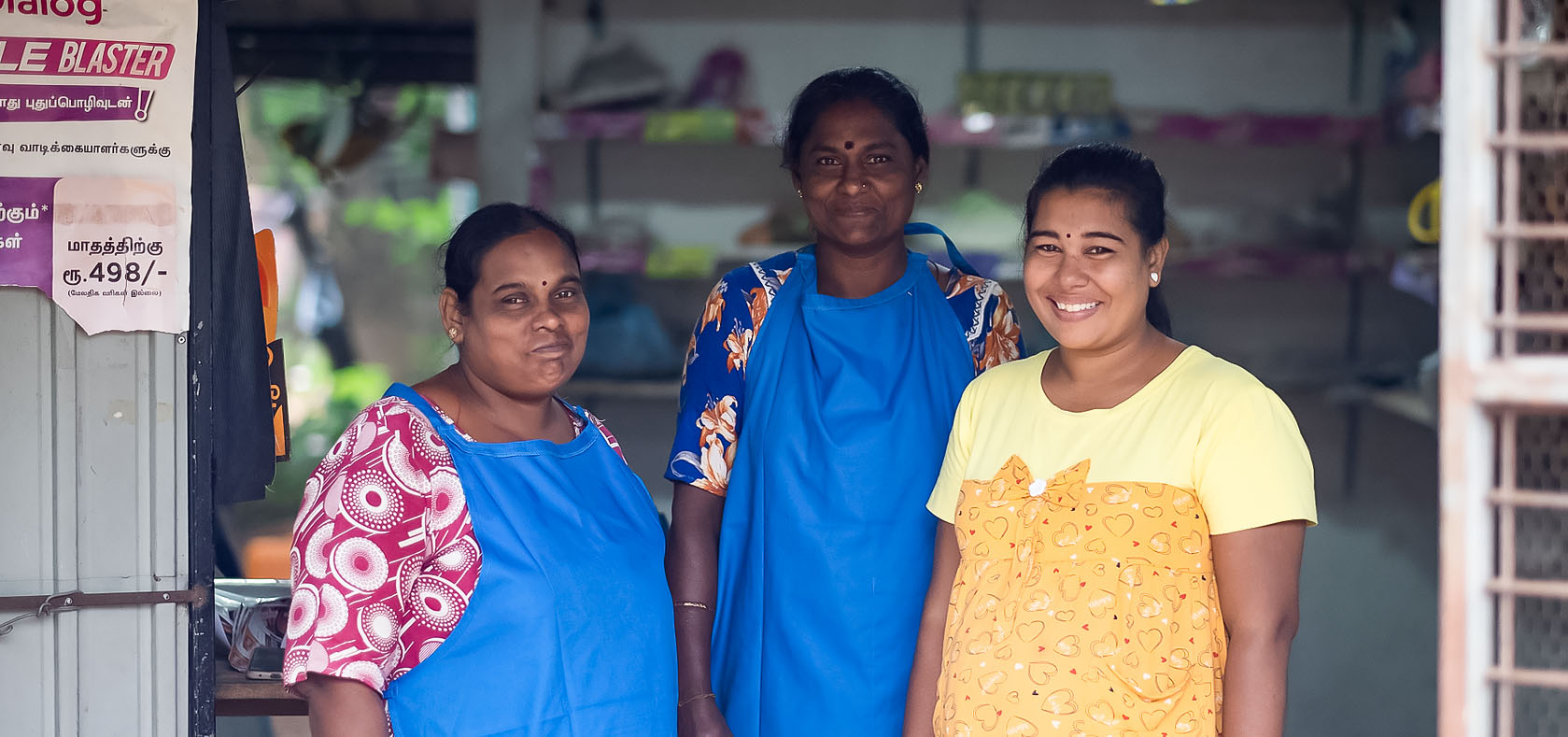 Mugunthan Jeyavinoja [far-right] a participant in UN Women’s economic empowerment programmes, pictured with her co-workers at her grocery shop in Puliyankulam, Vavuniya, Sri Lanka on 8 December 2022. Photo: UN Women Sri Lanka/Ruvin De Silva
