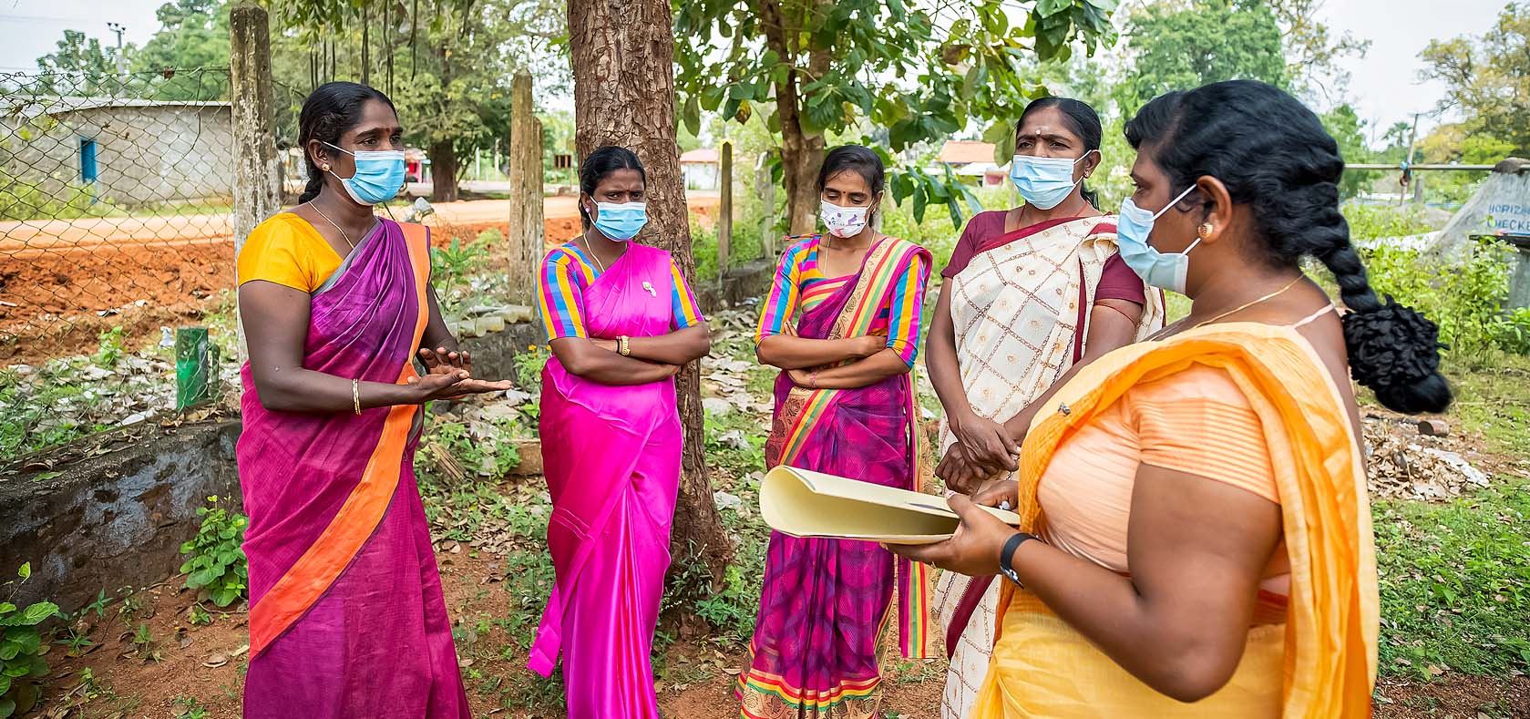Social activist Micheal Lusiya (far right) meets with community members in Vavuniya, Northern Province, Sri Lanka on 11 March 2022. Photo: UN Women/Raveendra Rohana