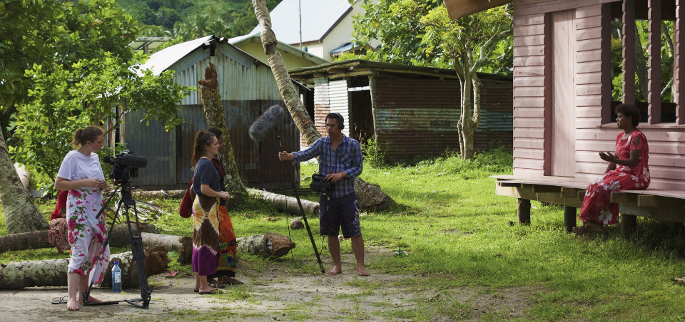 The filmmakers interview a woman in Batiki village during the making of the documentary.