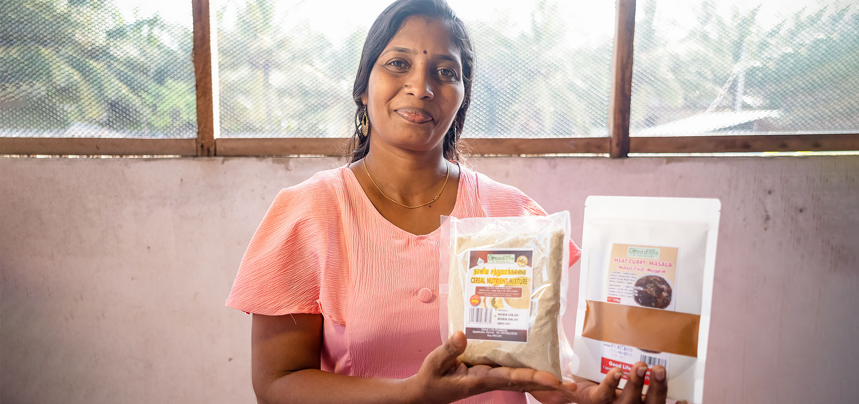 Jena shows some of the products she makes at her store in Uppukulam, Mannar in Sri Lanka’s Northern province on 14 March 2023. Photo: UN Women Sri Lanka/Ruvin De Silva