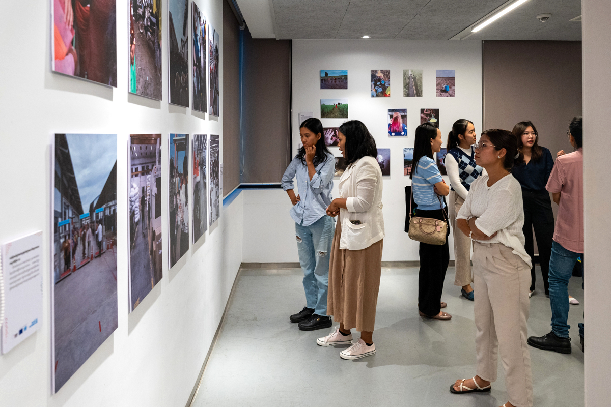 Visitors view exhibited works on 19 October at Raintree, Phnom Penh, Cambodia.