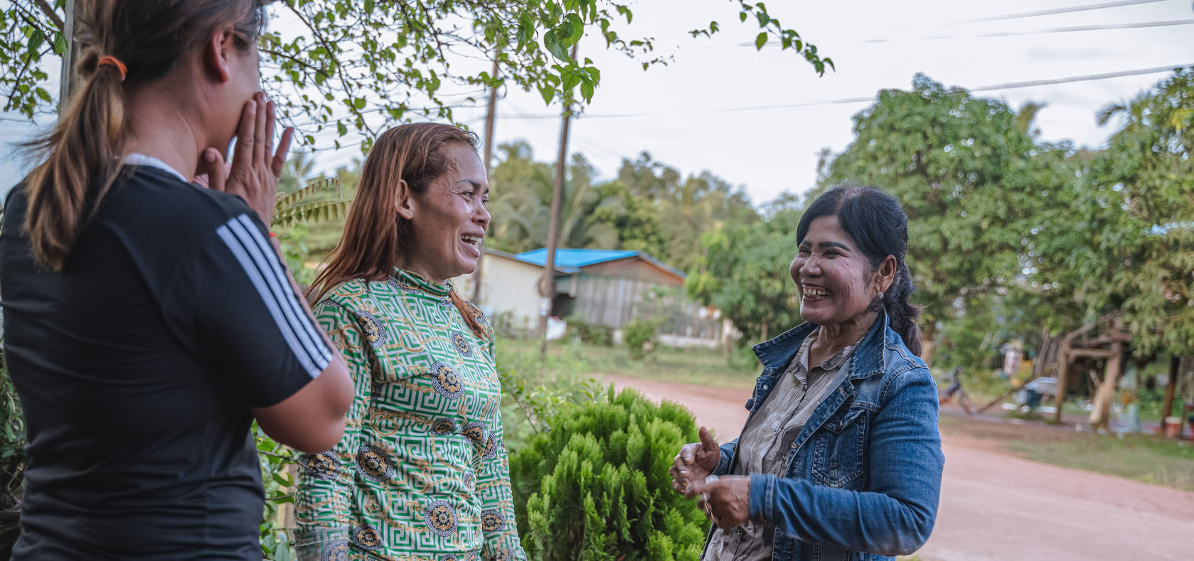 Norng Lim Heang (right) speaks to other women in Chrouy Svay Commune, Koh Kong Province, Cambodia. Photo: UN Women/Ploy Phutpheng