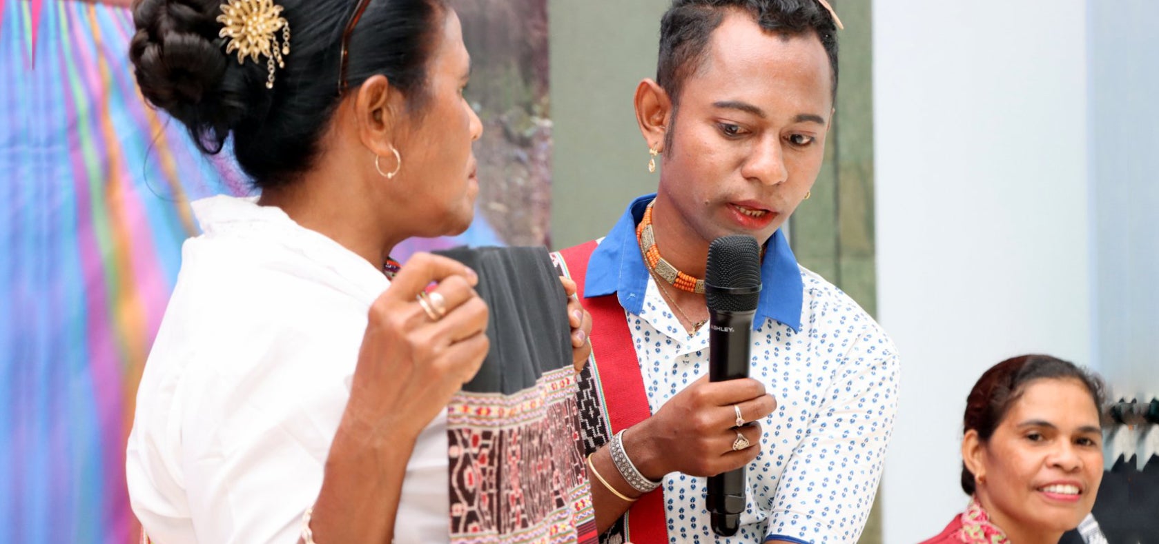 Rio, a 32-year-old active member of the Tais Weavers' Network, presents the tais he wove during the Tais Forum in Timor- Leste in 2023. 