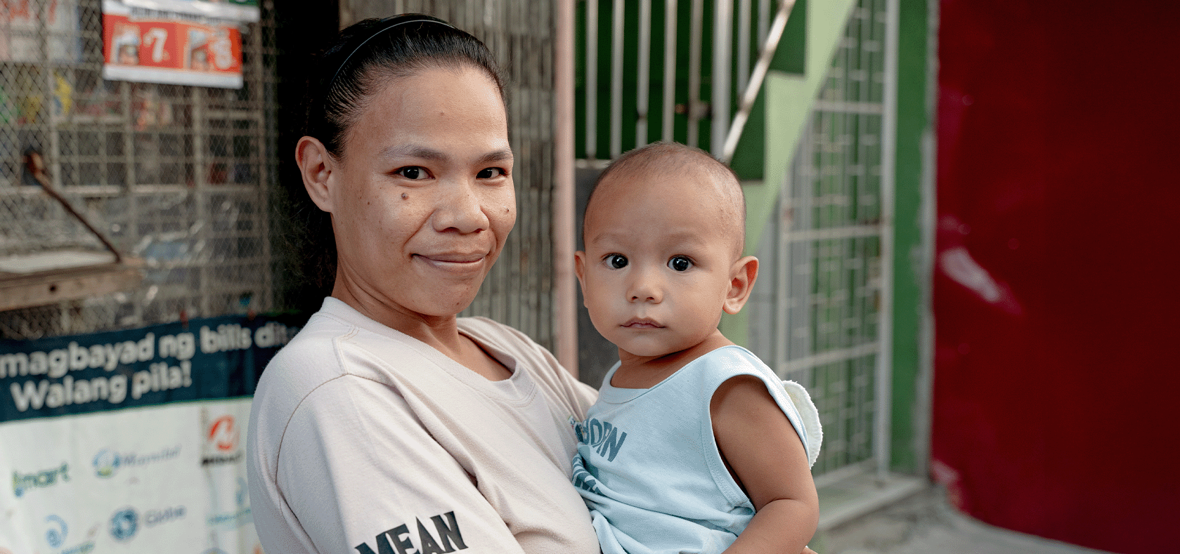 A mother and her son are seen at the A.N.A.K Food Bank Project, supported by UN Women Philippines and partners. Photo: UN Women/Pairach Homtong