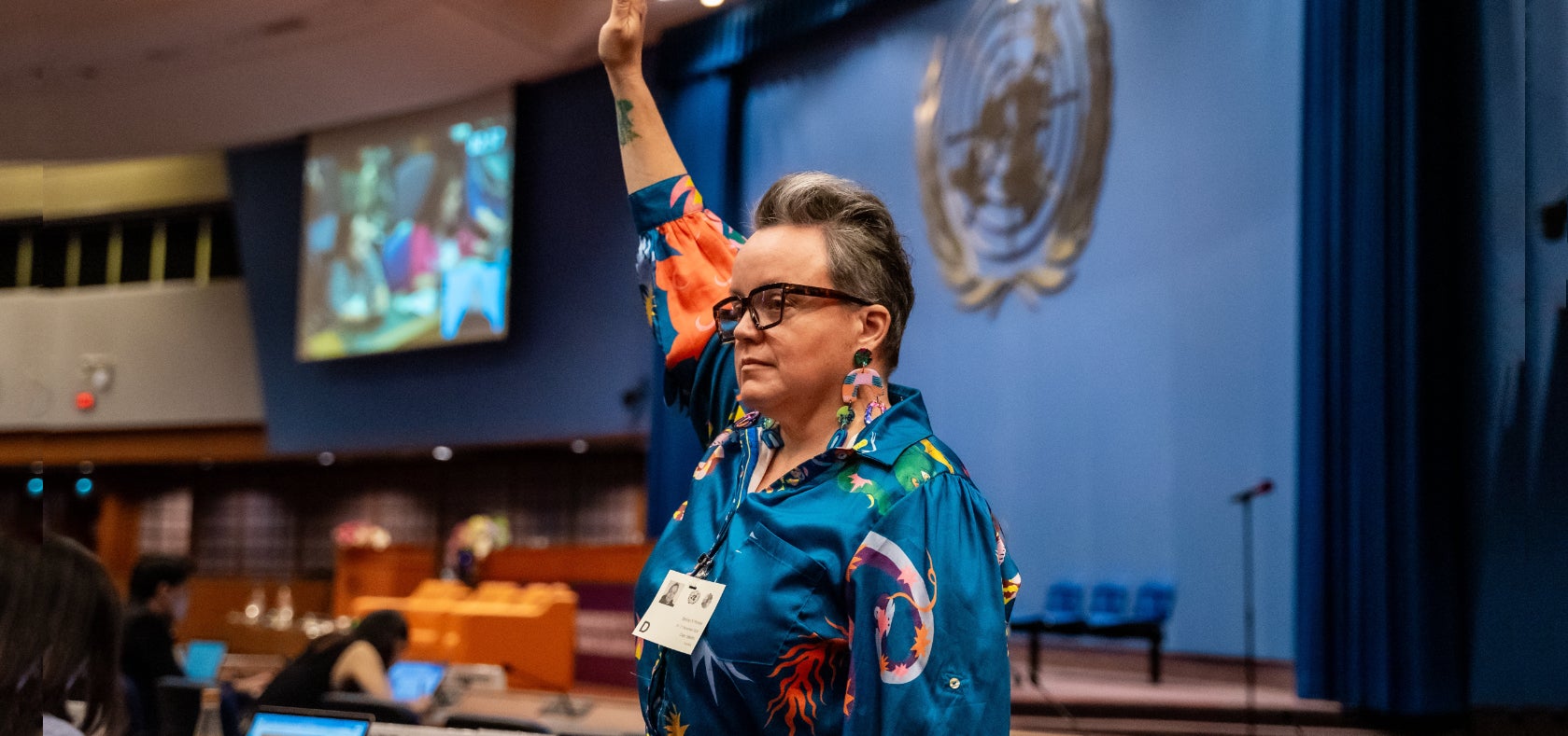 Clare Gibellini, Policy Officer at Women with Disabilities Australia, stands in the main conference during the Ministerial Conference.