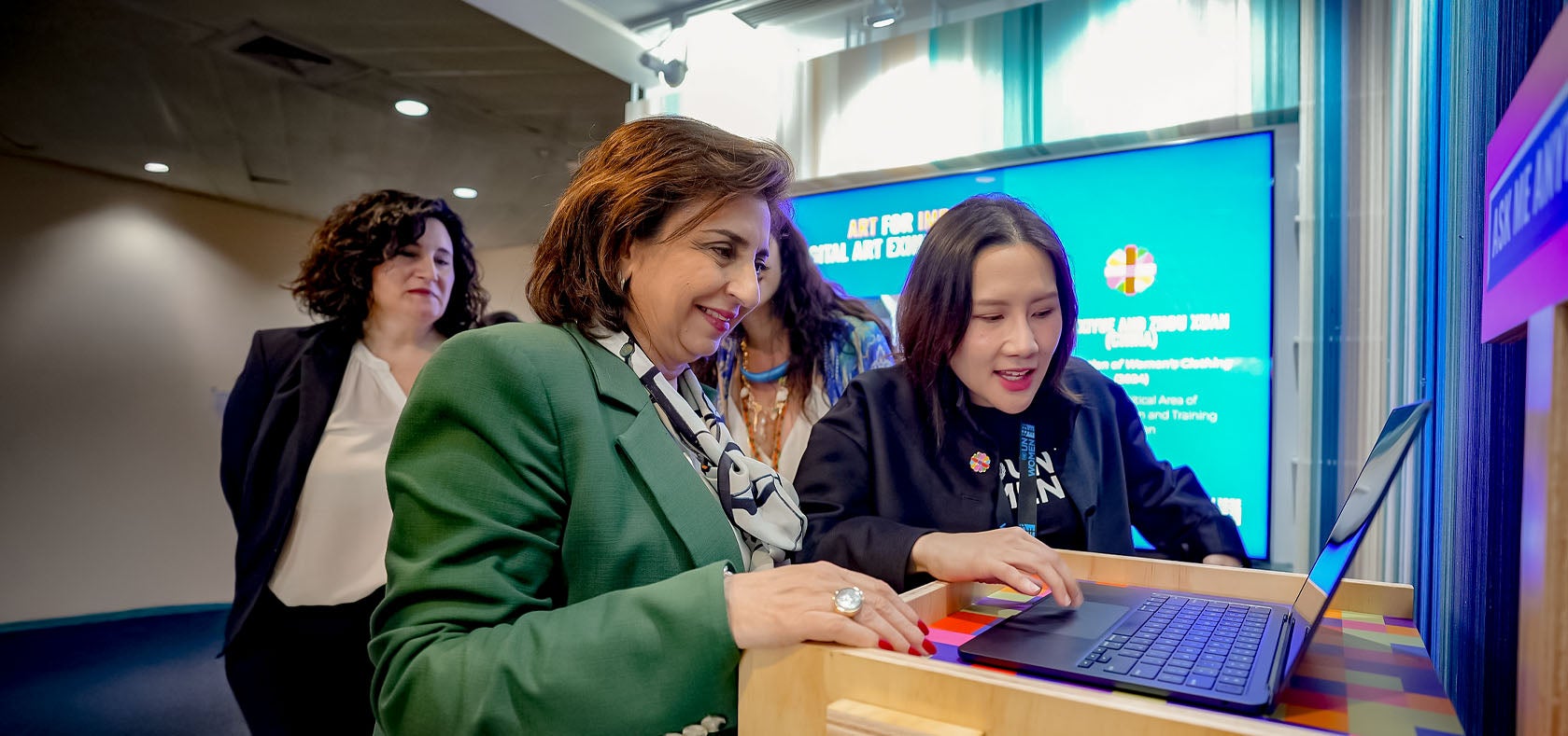 Sima Bahous, Executive Director of UN Women and Christine Arab, UN Women Regional Director visit the CSW GPT booth. Photo: UN Women/Pathumporn Thongking