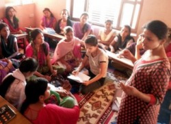 Conflict affected women and girls in discussion with facilitator
