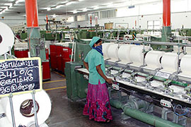 A woman garment worker on the job at a factory in Tamil Nadu, India. Photo courtesy of Fair Wear Foundation