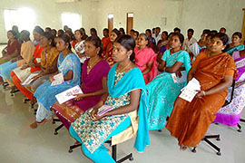Women garment workers listen attentively at a training session where they are empowered to speak up about workplace harassment. Photo credit: Fair Wear Foundation
