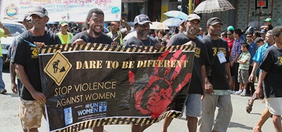 Fiji Men holding banner