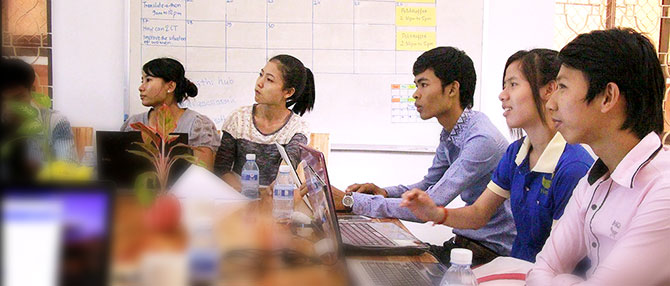 Young Cambodians learn how to use Wordpress during an ICT workshop in Phnom Penh in July 2014. Photo: UN Women/Veronika Stepkova