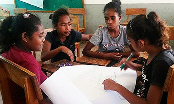 Students from Suai, Timor-Leste, discuss gender roles at school. Photo: UN Women/Lauren Gecuk