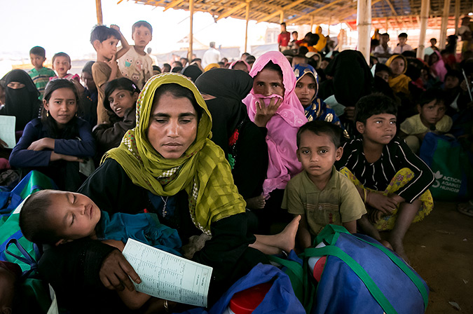Women are seen at an ACF donation point In Balukhali Rohingya Refugee camp February 1, 2018 in Chittagong district, Bangladesh. Photo: UN Women/Allison Joyce