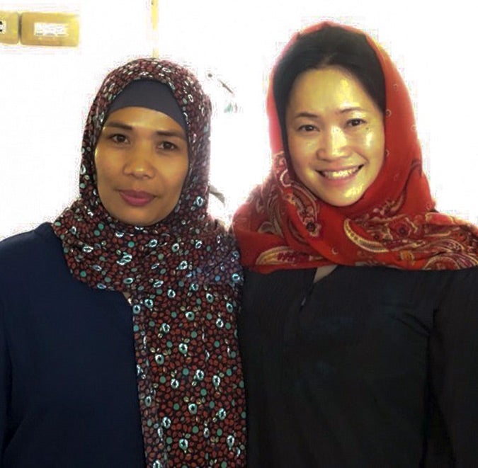 UN Women's Regional Director with Okura Samporna, Captain of Barangay Pacalundo in Balo-i. She is supporting the IDPs to receive humanitarian relief and is one of the few women captains of a village in the region. Photo: UN Women/Carla Silbert