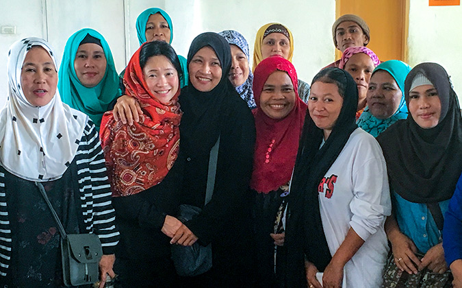 UN Women's Regional Director with women displaced by the Marawi siege in Balo-i. They are eager to build their economic empowerment and rebuild secure lives for their families. Photo: UN Women/Carla Silbert
