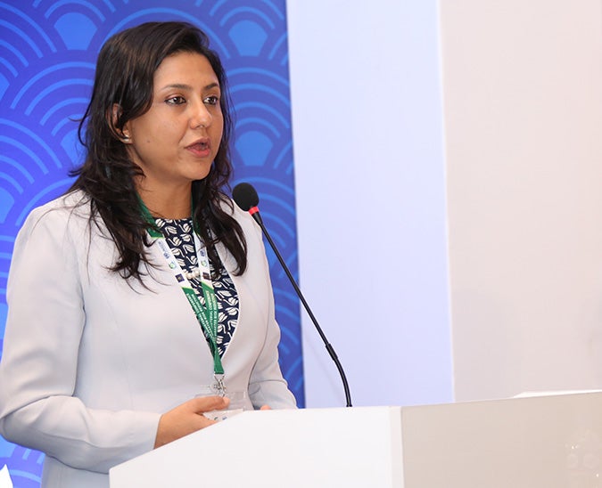 Smriti Aryal, Acting Head of UN Women Myanmar and Regional Advisor for Humanitarian Action and Disaster Risk Reduction, presents the progress review report of the Gender Stakeholder Group at the Ulaanbaatar meeting. Photo: UNFPA/Tim Jenkins