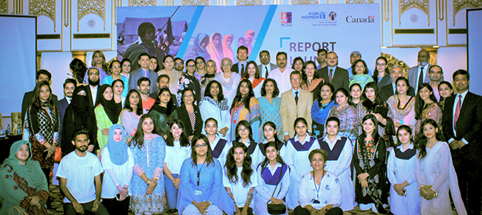 Guests at the 19 July report launch pose with UN Women’s team. Photo: UN Women/Raza Saeed