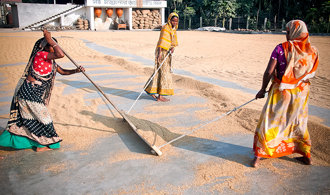 Women working in a rice factory, Netrakona, Bangladesh. Photo: UN Women/Saikat Mojumder