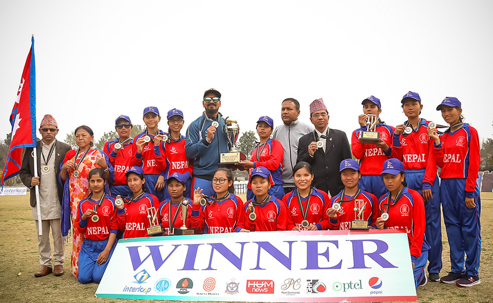Team Captain Bhagwati Bhattarai-Baral (centre), holds the winning trophy as the team celebrates its victory at the First International Women’s Blind Cricket Series. Photo: UNDP/Asfar Hussain Shah