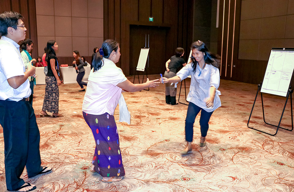 A Gender Relay Race, where three teams competed to write gender or sex attributes they think relate to men or women, was one of the activities at the Gender in Humanitarian Action Training-of-Trainers Workshop. Photo: UN Women/Cecilia Truffer
