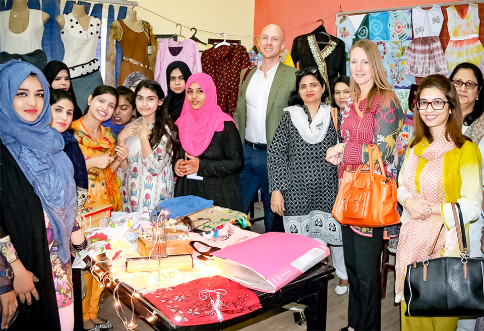 Students of the Pakistan Ready-Made Garments Technical Training Institute in Karachi showcase their wares for the delegates. Photo: UN Women/Habib Asgher