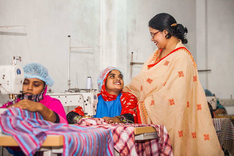 Parveen Akter, owner of Glamour Boutique and Training Center, with budding workers at her training center at Ghop Nawapara Road in Jessore. Photo: UN Women/Fahad Kaizer