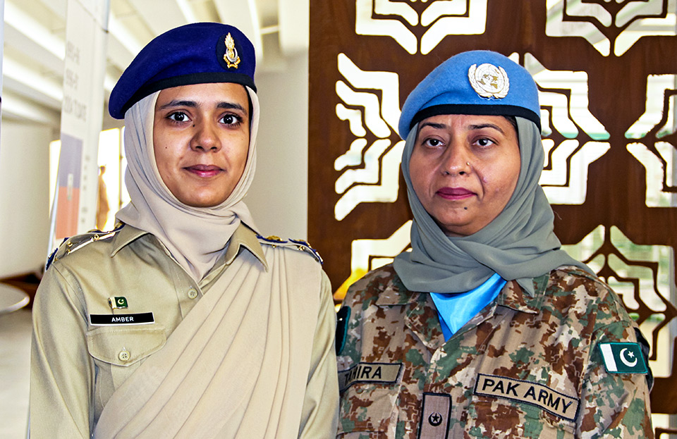 In the photo, two females soilders from Pakistan in their uniform