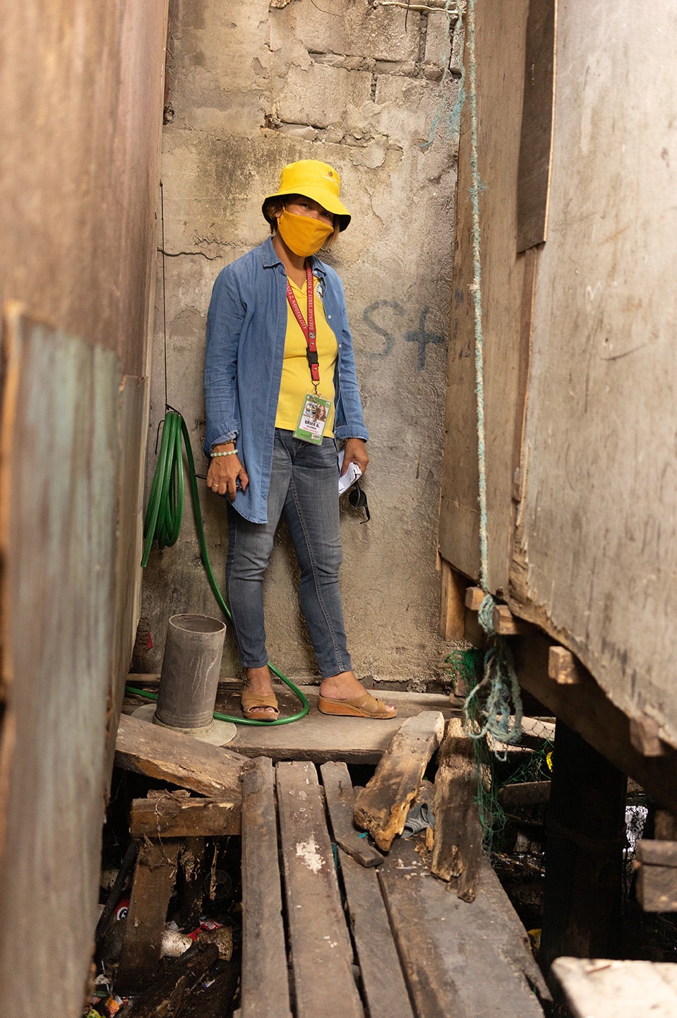 Irma Bantigue Glomar is out for her regular community rounds in Barangay Tanza 2. Photo: UN Women/Christine Chung