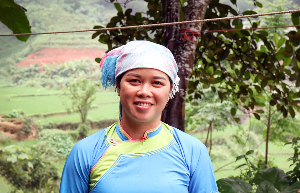 Nhung poses in Quang Kim on 6 April 2021 wearing traditional ethnic dress.  Photo: UN Women/Thao Hoang