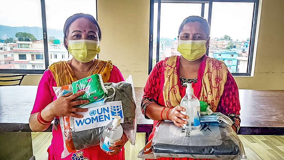 Women For Human Rights, Single Women Group distribute essential items such as masks, sanitizers, sanitary napkins, oximeter and personal protective equipment to single women in Budanilkanta Municipality, Kathmandu. Photo: Courtesy of Sumeera Shrestha