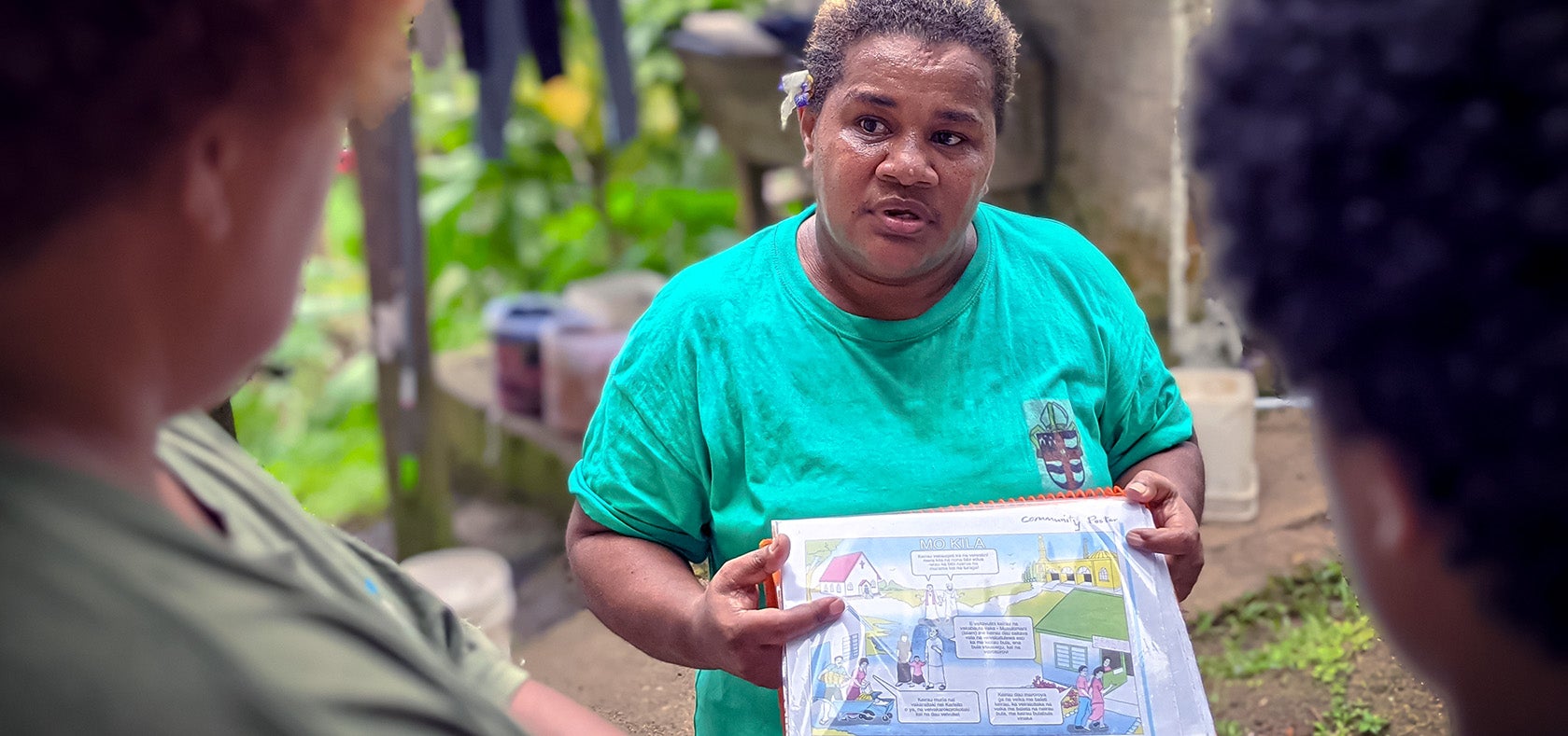 As a community activist with House of Sarah, Alisi Dari uses tools adapted from the SASA!Faith toolkit to discuss power and violence with community members. New Town, Suva. Photo: UN Women/Miho Watanabe