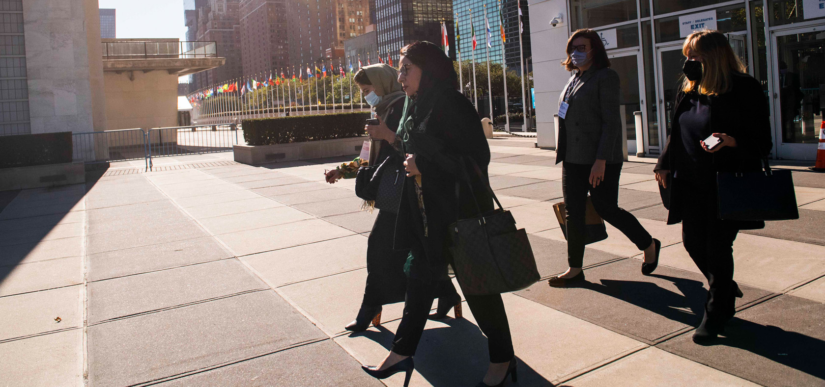 A delegation of Afghan women leaders and human rights defenders walk to the meeting 'New Chapter in Afghanistan: Ensuring Support of Afghan Women & Girls' at UN Headquarters on 21 October 2021. Photo: UN Women/Amanda Voisard