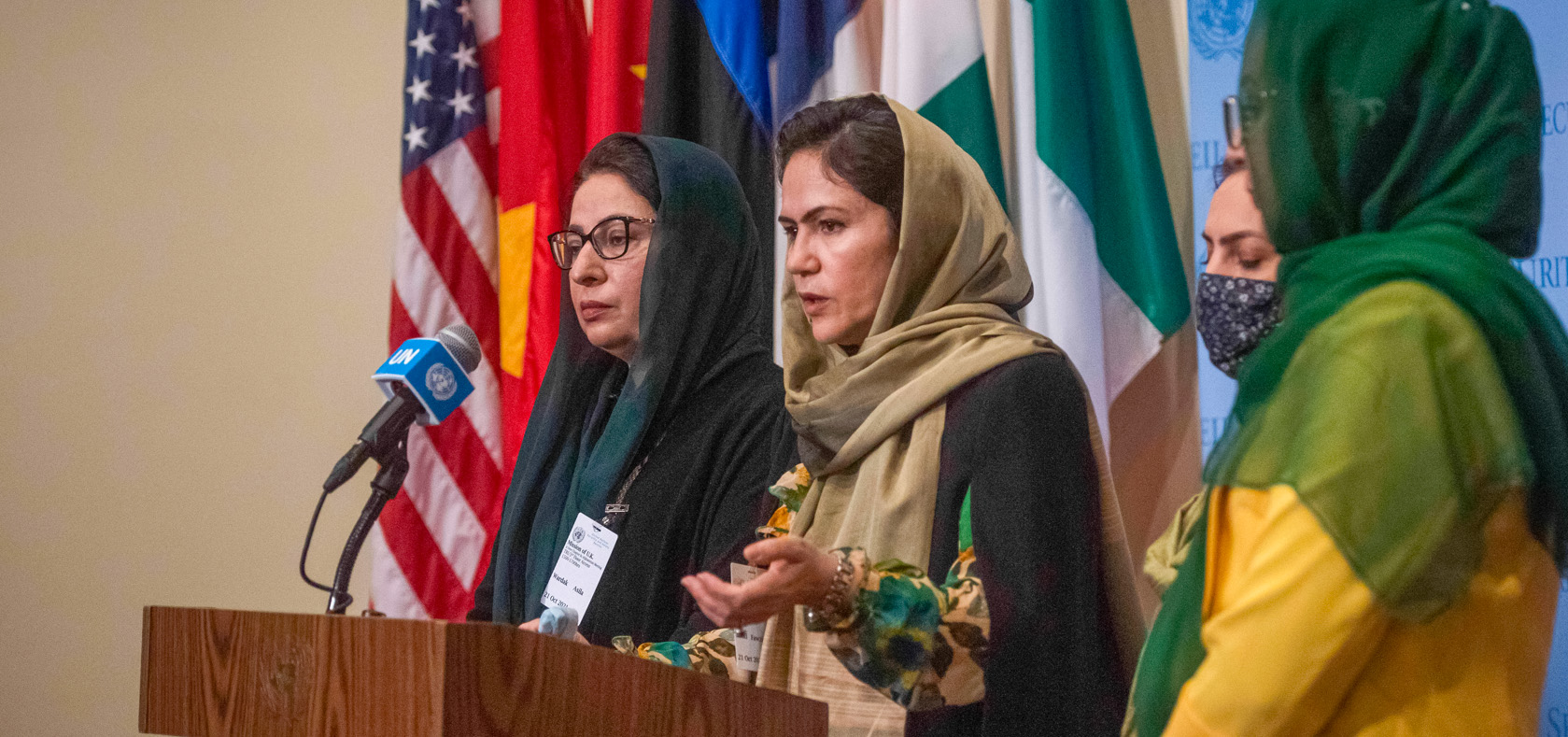 Afghan women leaders and human rights defenders speak to press outside of the UN Security Council chambers on 21 October 2021. Pictured from left to right: Asila Wardak, Fawzia Koofi (speaking), Anisa Shaheed and Naheed Farid. Photo: UN Women/Amanda Voisard