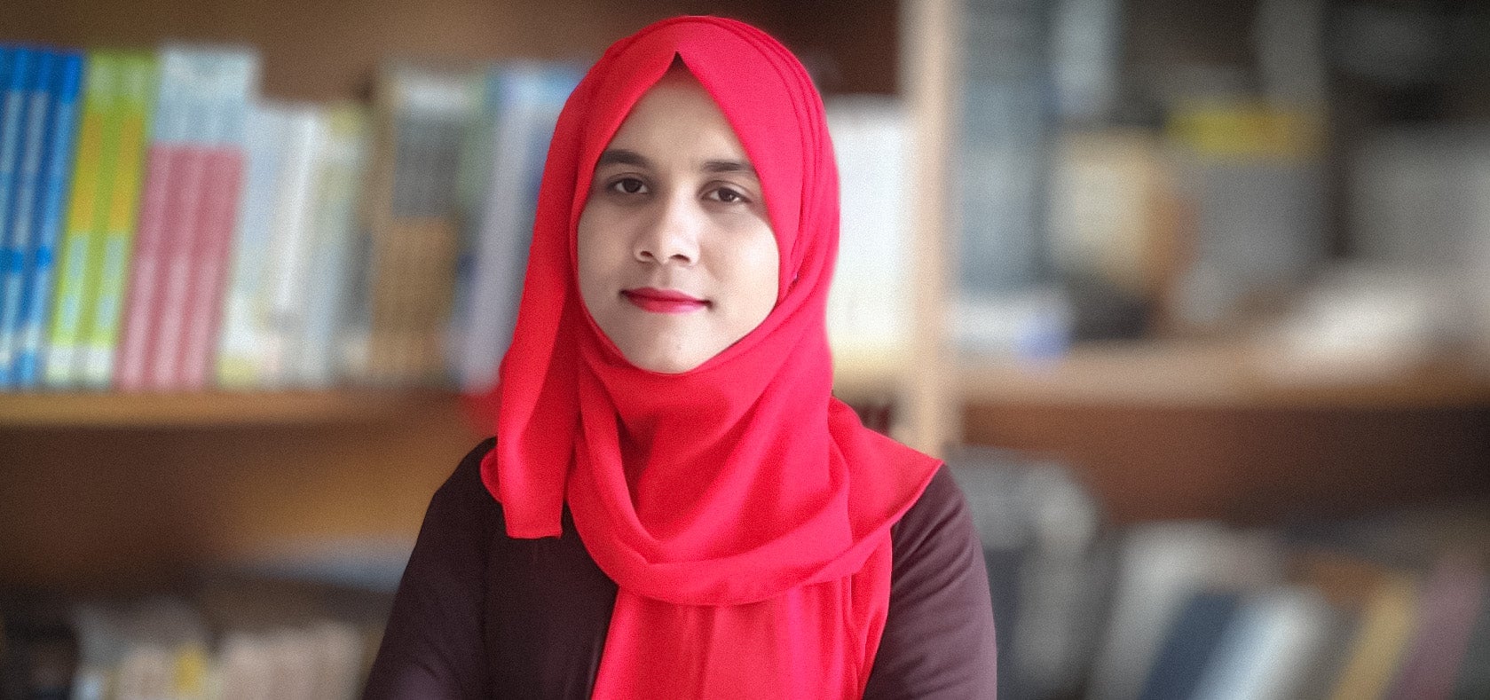 Lucky poses in the library of the Asian University for Women, in Chittagong, Bangladesh, on 15 March, 2021. Photo courtesy of Isabel Borges Pereira