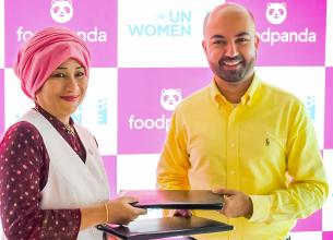 Sharmeela Rassool, Country Representative, UN Women Pakistan and Munteqa Peracha, Managing Director, foodpanda exchanging the signed agreement to promotion of workplace safety and gender equality for women. Photo: UN Women/Hassan Abbasi