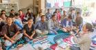 A trainer leads male partners of women entrepreneurs in a gender equality training in Lantan Village, North Lombok, Indonesia, on 12 August 2022 as part of a UN Women programme to help women grow their businesses. Photo: UN Women/Zola Photography